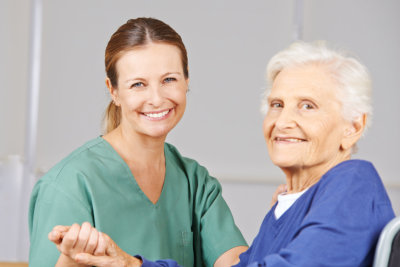 Old woman with geriatric nurse in nursing home